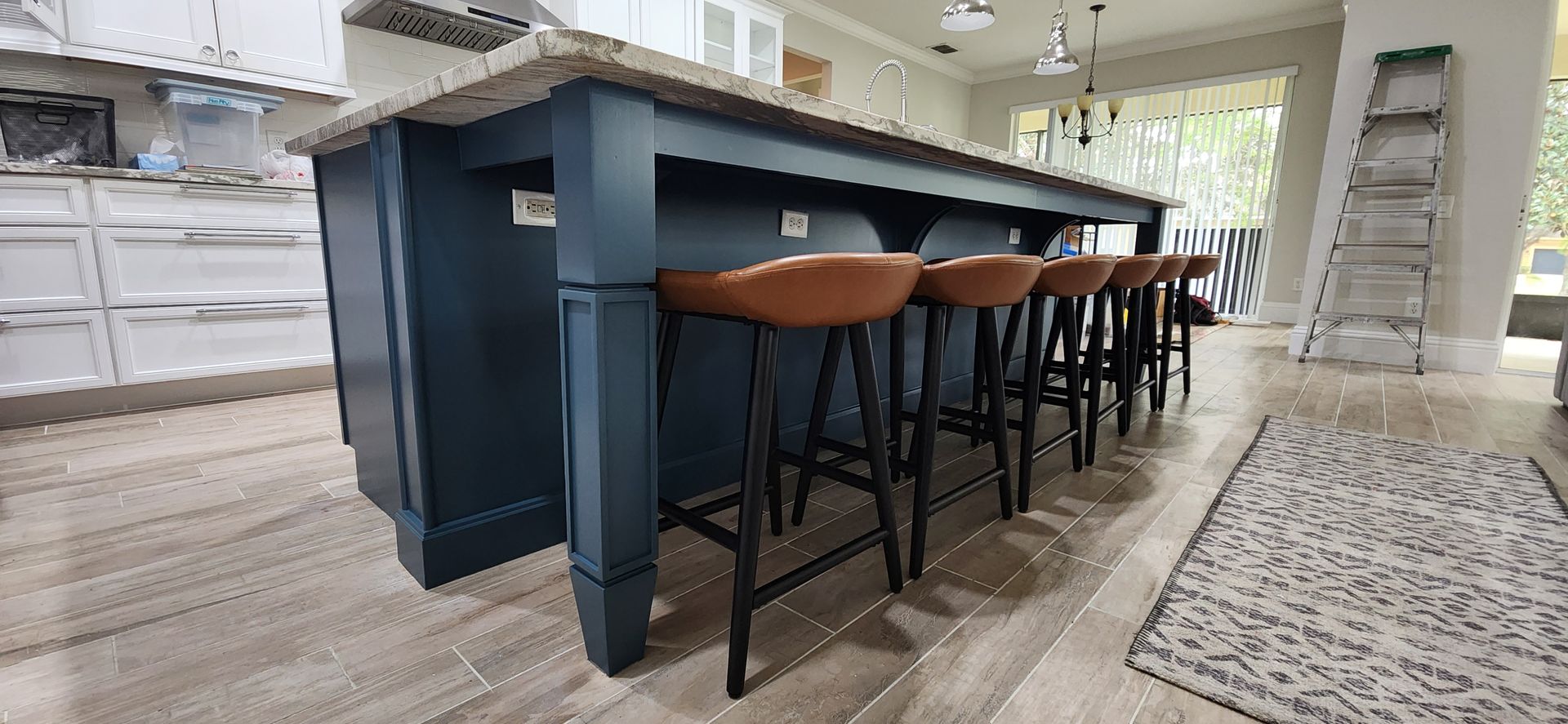 A staircase with a skylight and a clock on the ceiling.
